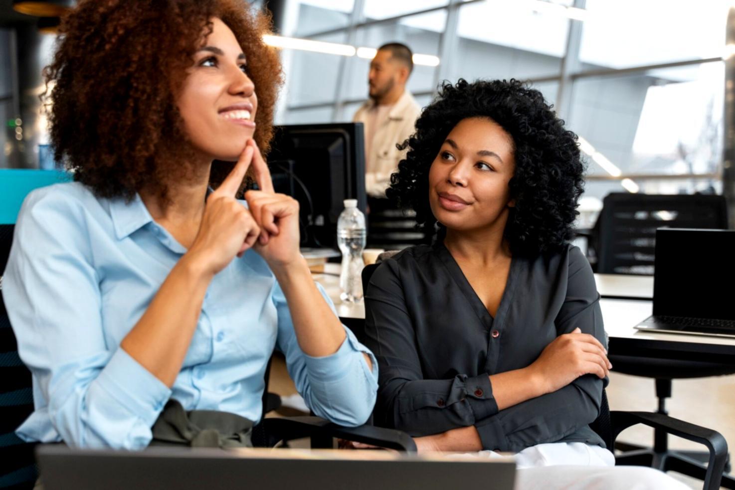 Modern workspace featuring UI/UX design planning materials and digital interface sketches